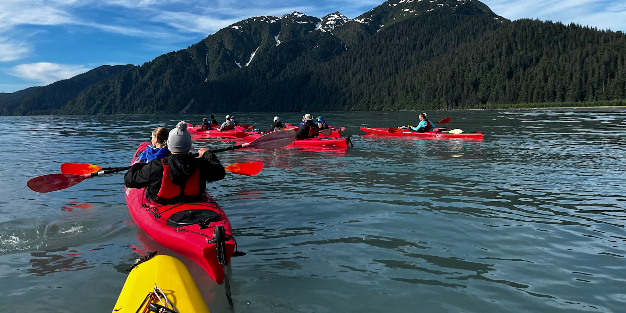 Family group on a guided Kayaking excursion in Peterson Bay Alaska